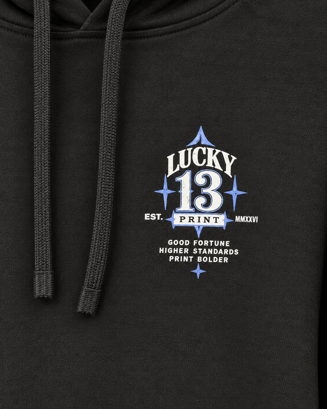 Close view of the approved Lucky 13 left-chest print on black hoodie fabric