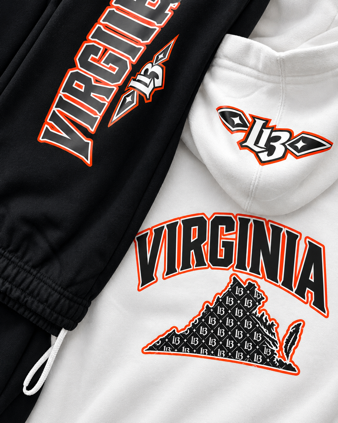 Black joggers with the orange-outlined VIRGINIA and L13 leg print, laid beside the white hoodie showing the arched VIRGINIA and L13-filled state print