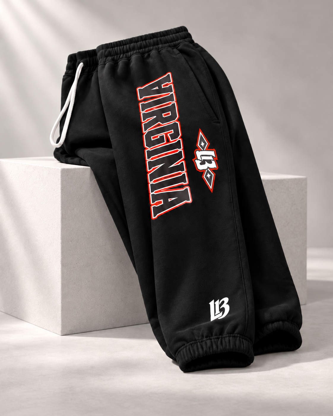 Black joggers with a small white L13 at the ankle cuff
